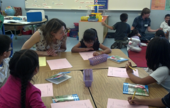 Woman Tutoring Children